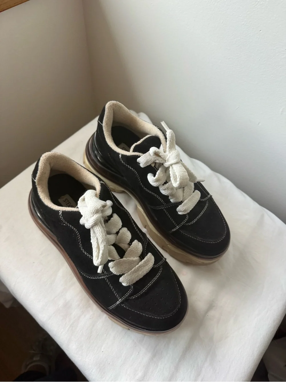 Steve Madden Evolved Sneaker in black with a chunky cream and tan platforms 9.5